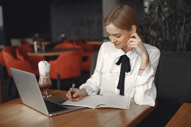 businesswoman-sitting-table-with-laptop